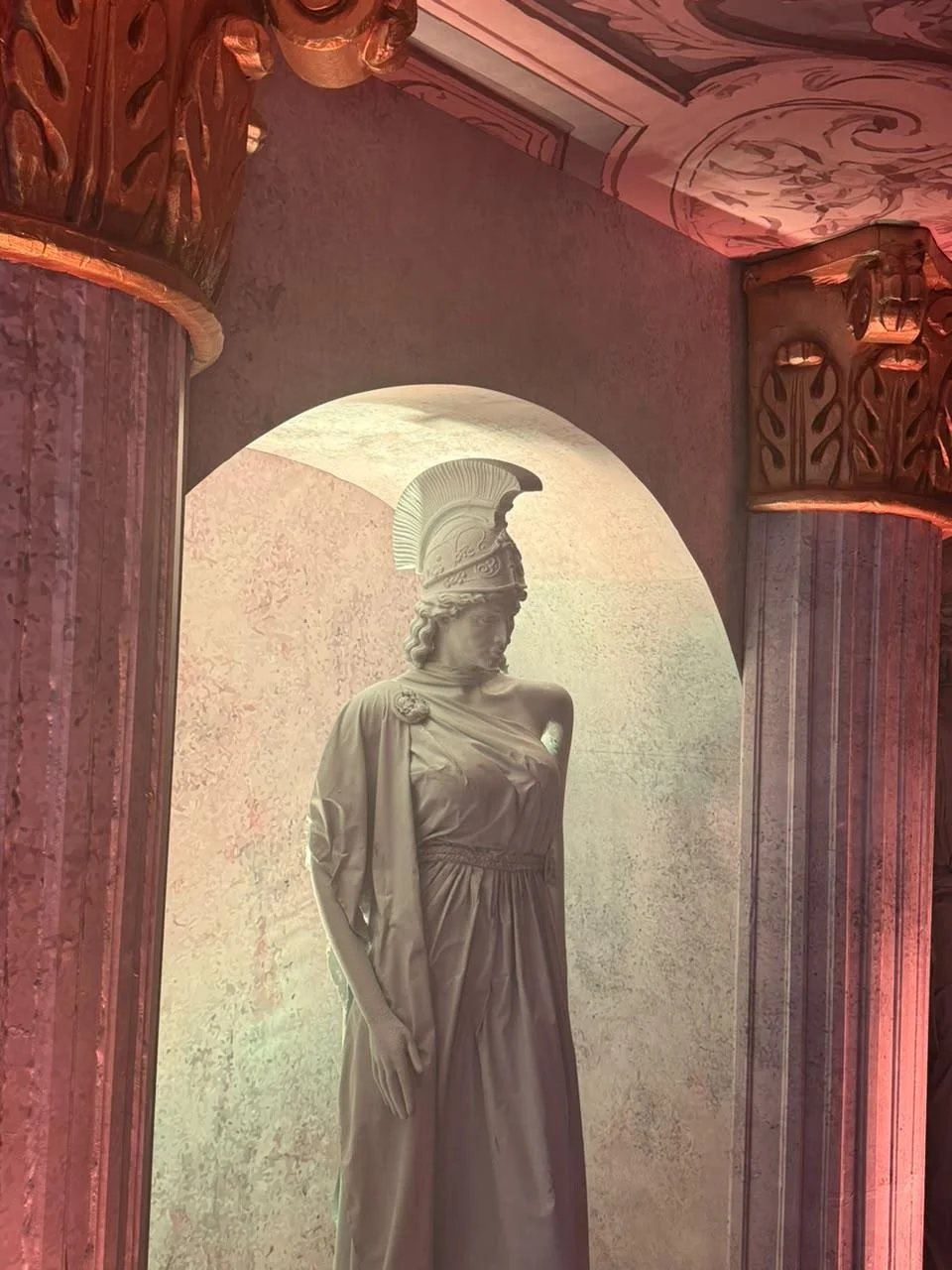 life size athena statue in classical temple
