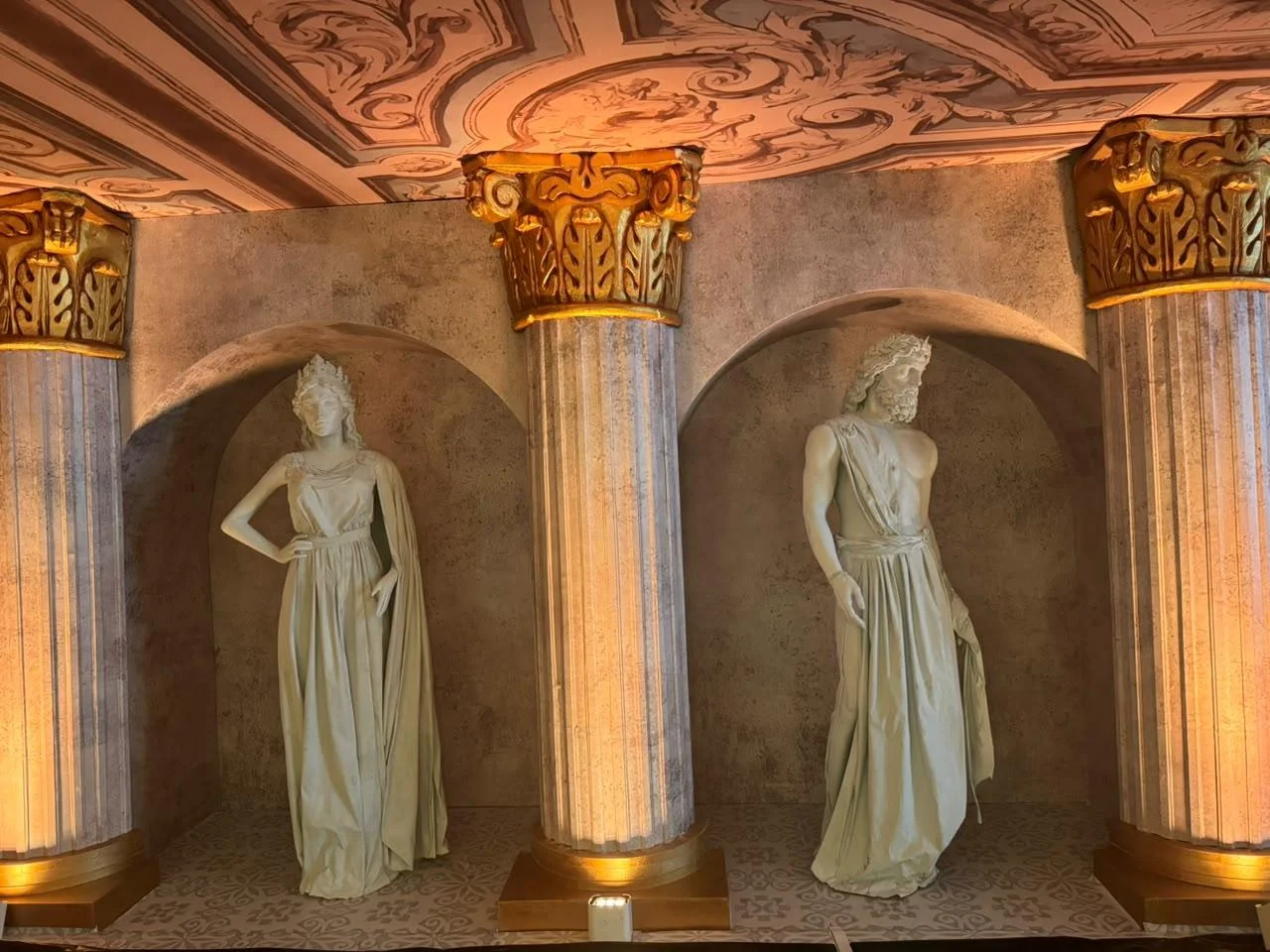 life size greek god statues at event
